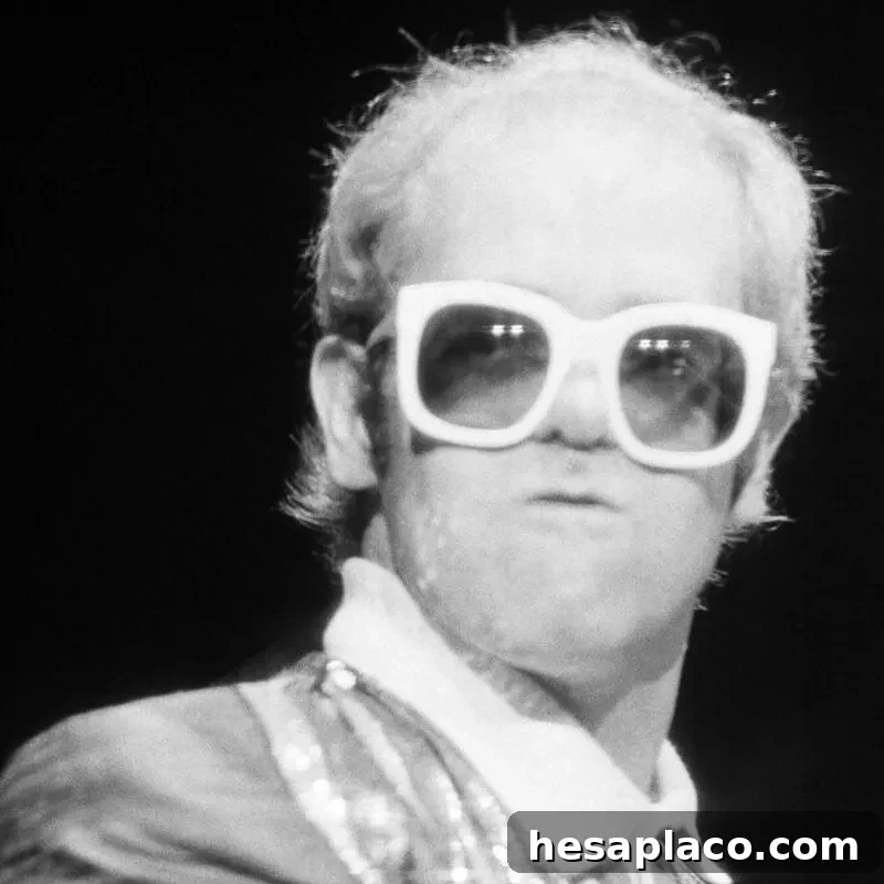 Elton John performs at the piano at New York's Madison Square Garden, August 10, 1976. (AP Photo)