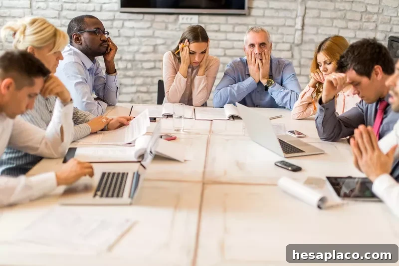 Large group of worried business people having a meeting