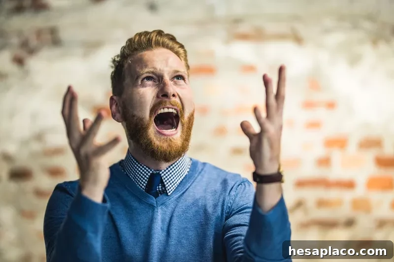 Angry man shouting at sky