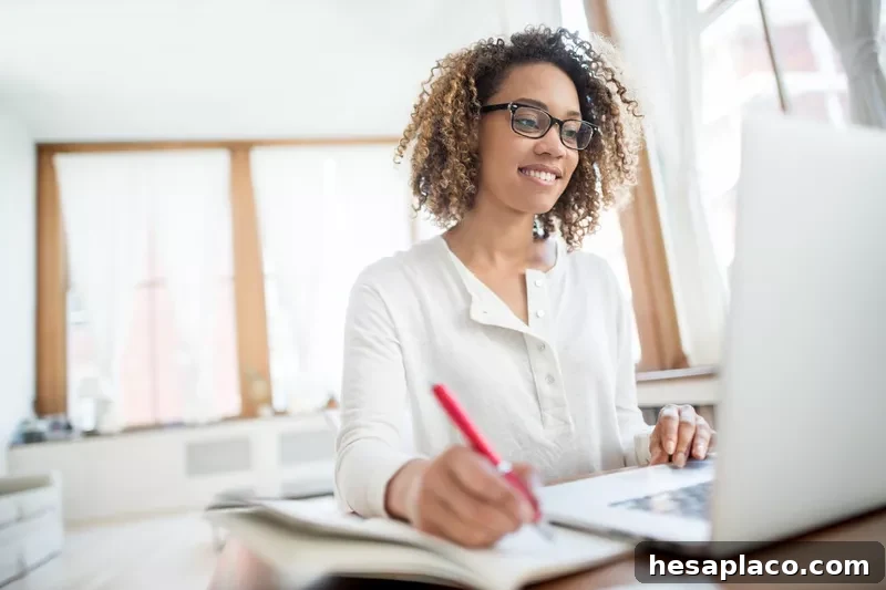 Young businesswoman working at home