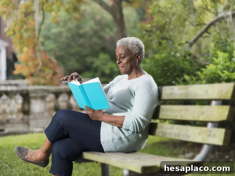 Senior black woman reading a book