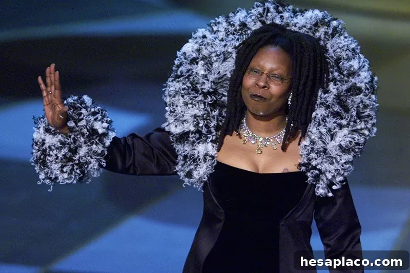 Whoopi Goldberg waving