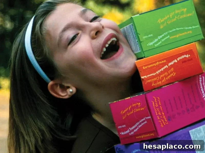 Girl Scout with cookie boxes