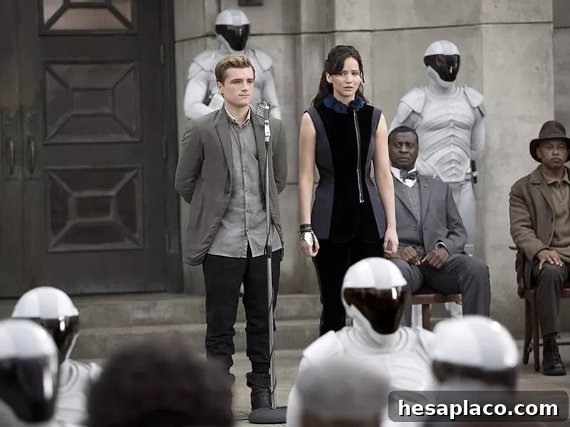 Afemo Omilami, Josh Hutcherson, and Jennifer Lawrence in The Hunger Games: Catching Fire (2013)