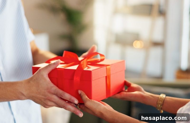 Love, gift and giving with hands of couple for valentines day celebration, box or bonding. Relationship, care and romance with man and woman at home for support, connection or present together