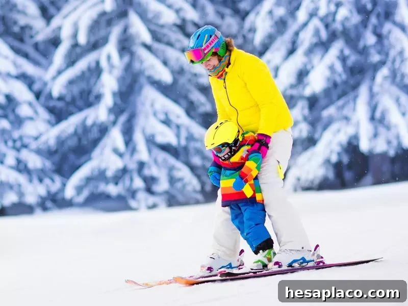 Active mother and little boy learning to ski