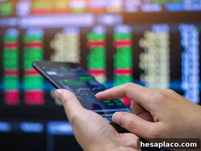 Businessman checking stock market on mobile phone