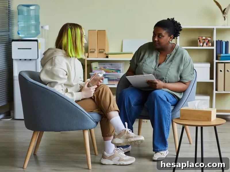 Social worker talking to teen girl