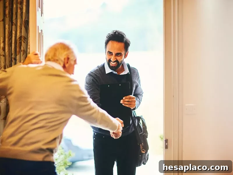 Senior man welcoming a healthcare social worker
