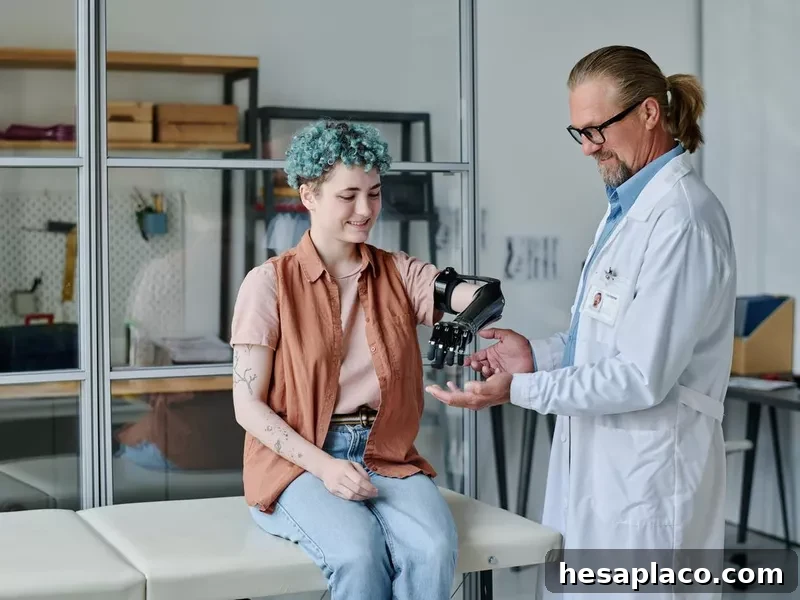 Smiling young woman with prosthetic arm consulting doctor