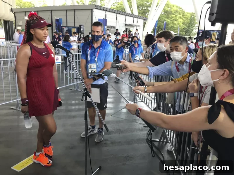 Tennis player Naomi Osaka speaks with journalists