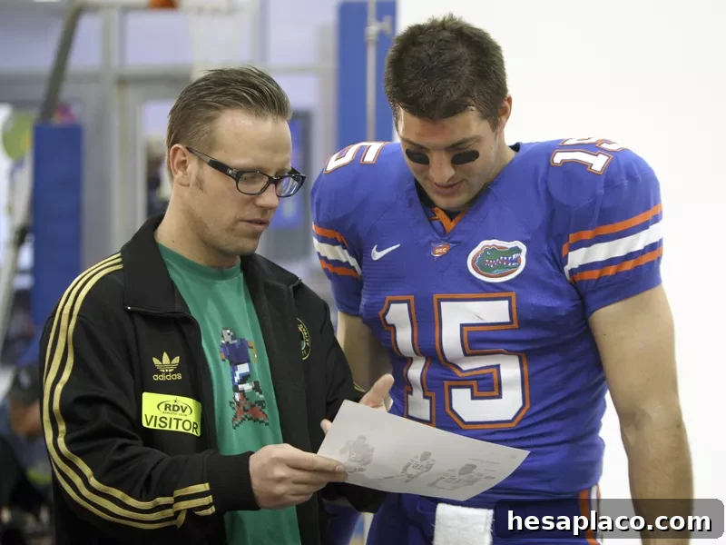 EA Sports creative director Larry Boltutis with Florida quarterback Tim Tebow