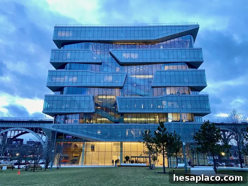 Columbia Business School's Henry Kravis Hall in Manhattanville, New York City, lit up at dusk