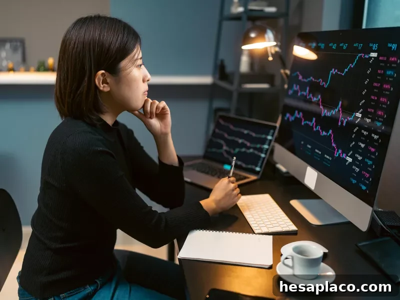Young woman doing cryptocurrency business trading on her computer