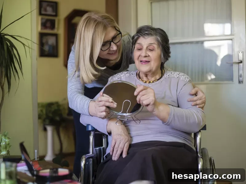At home caregiver helping senior woman in wheelchair