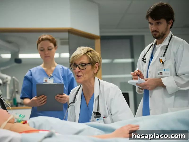 Doctor talking with patient while another doctor and physician assistant take notes