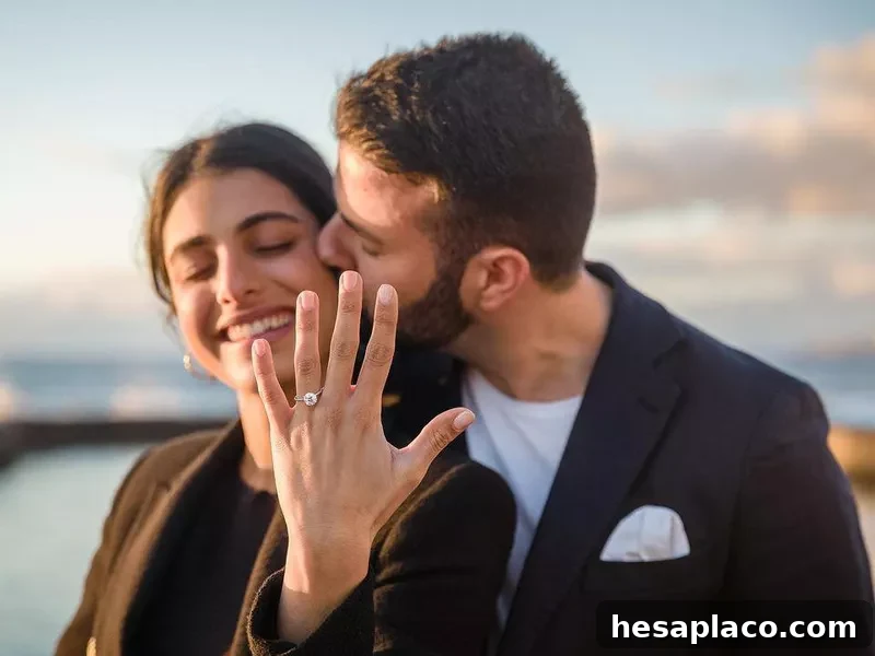 Happy woman displaying her engagement ring from loving fiancé