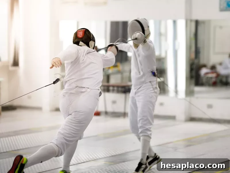 Male fencing athletes playing