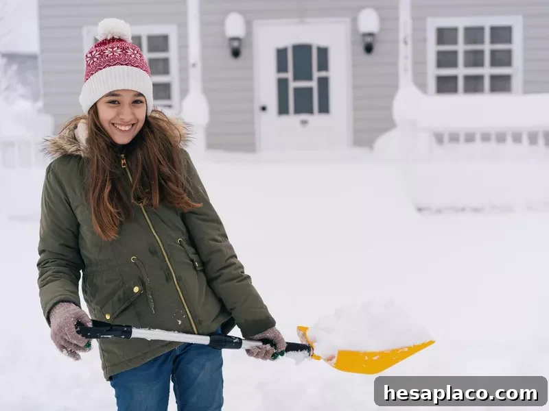 Girl holding a snow shovel