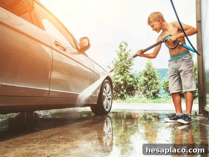 Boy helps to wash a car