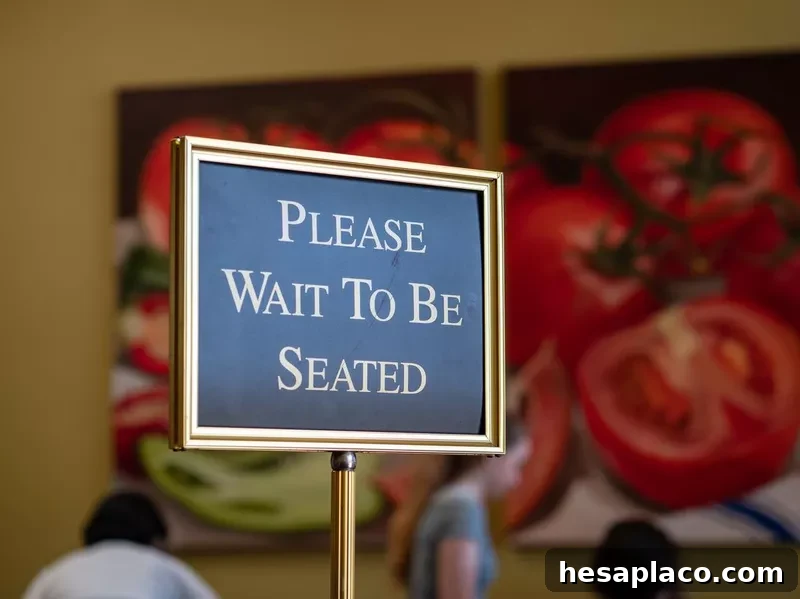 Please wait to be seated sign at the front of a restaurant