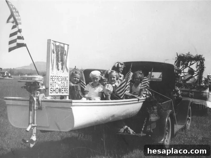 Children in a boat during a Fourth of July parade