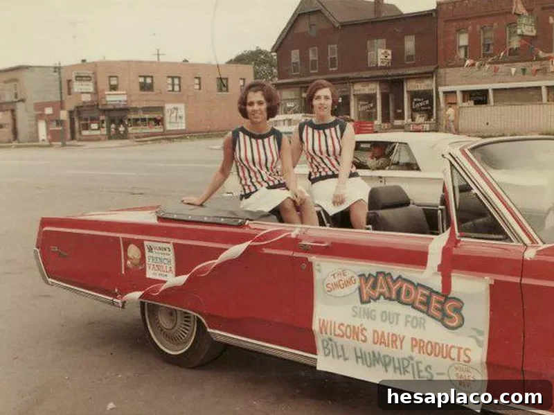 Girls in a convertible during a patriotic parade