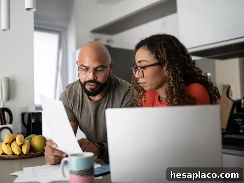 Couple doing home finances together at home