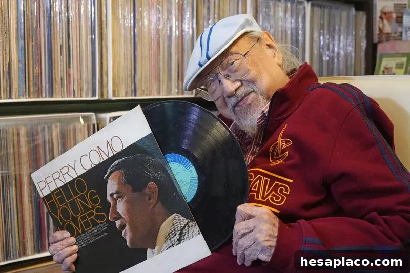 Ray Cordeiro, Hong Kong's oldest DJ, with a vinyl record