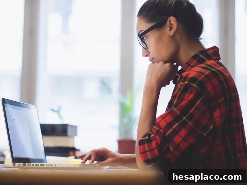 Online researcher looking at computer