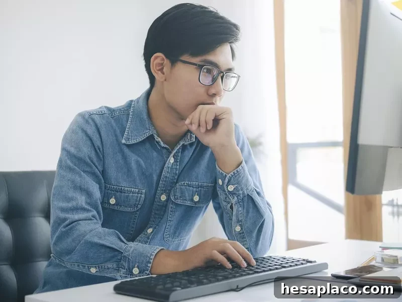 Website tester working at his computer