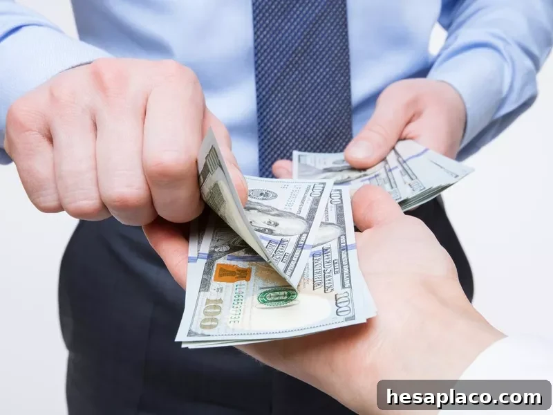 Hands exchanging money.