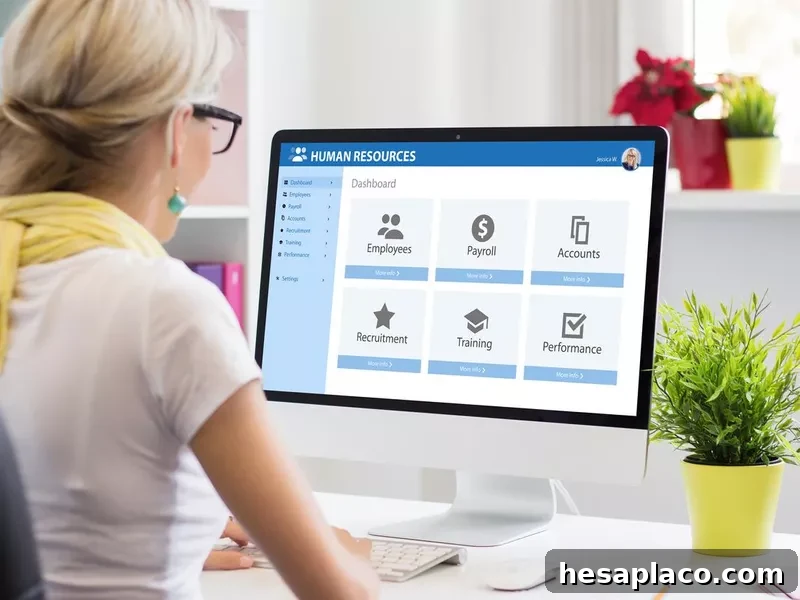 Woman working with human resources software on computer