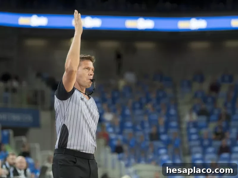Referee blowing whistle