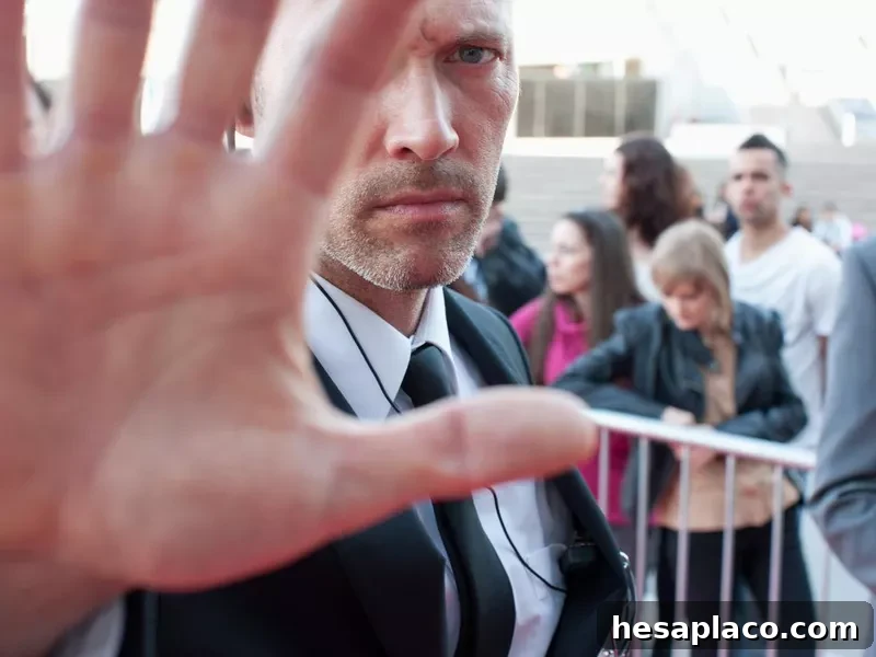 Bodyguard blocking camera