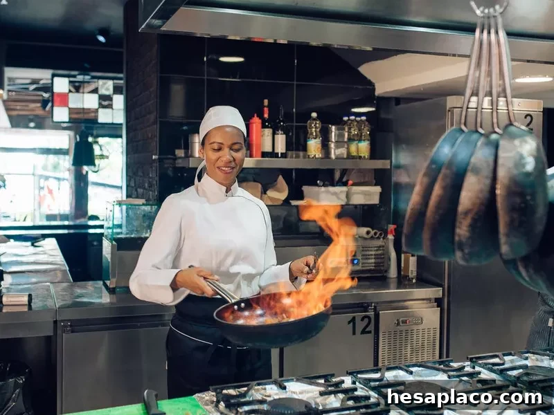 Female chef preparing a flambé specialty
