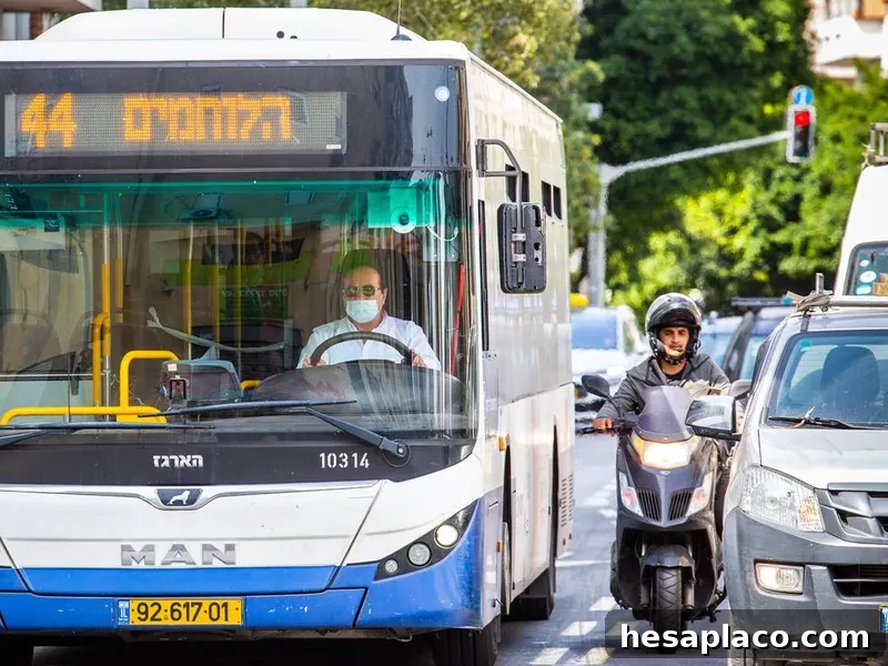 Bus driver driving bus on busy city street
