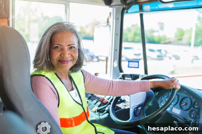 Female bus driver holding wheel