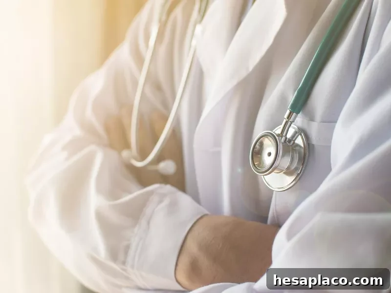 Medical doctor in white gown uniform
