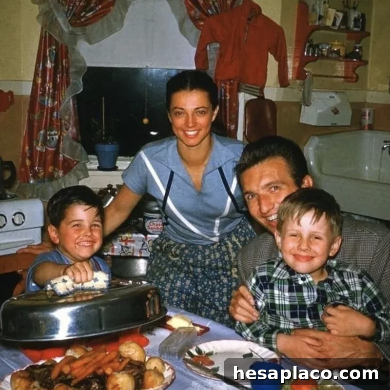Family of four having dinner in the 1950s