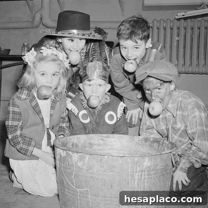 Kids bobbing for apples in the 1920s